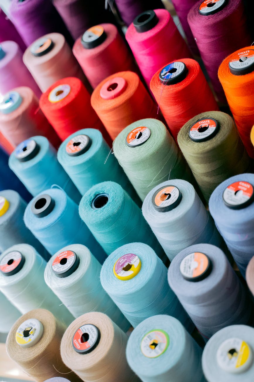 white green and red thread rolls